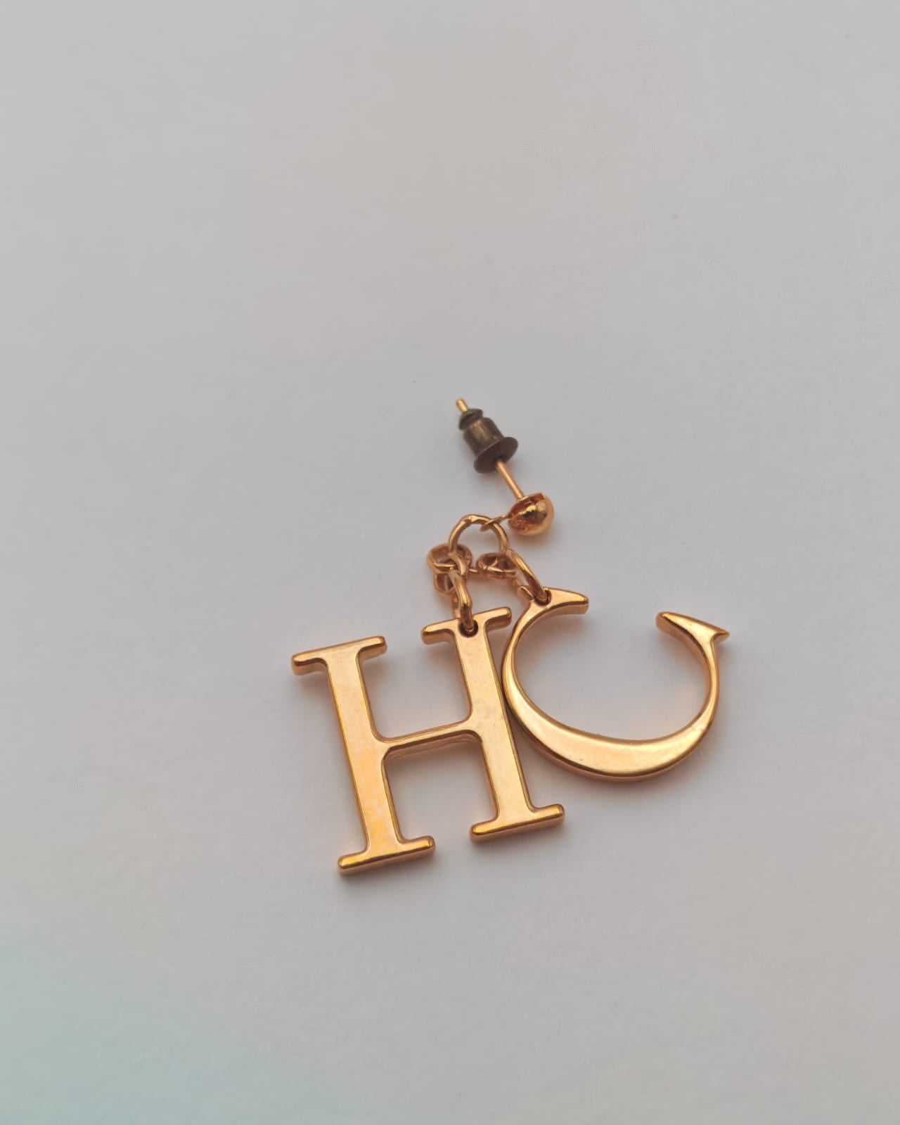 Carolina Herrera Gold-Tone “CH” Logo Drop Earrings – Statement Design