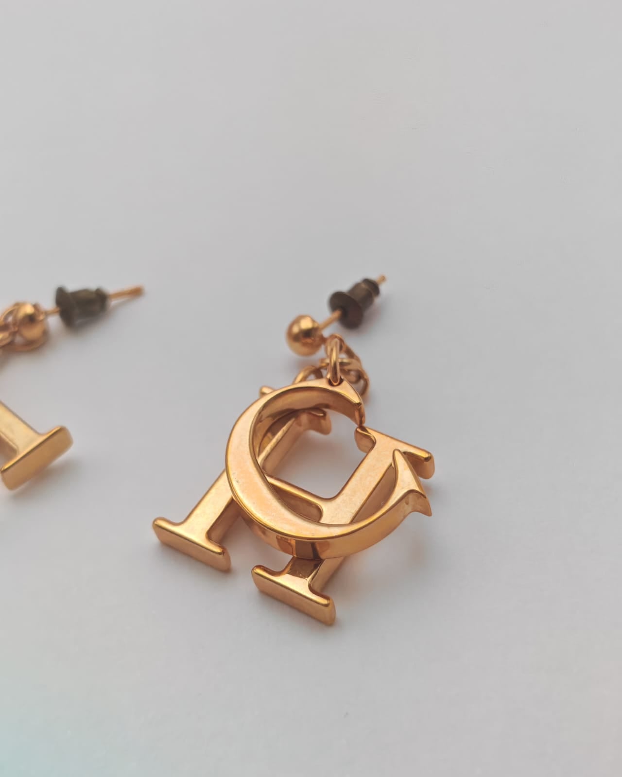 Carolina Herrera Gold-Tone “CH” Logo Drop Earrings – Statement Design