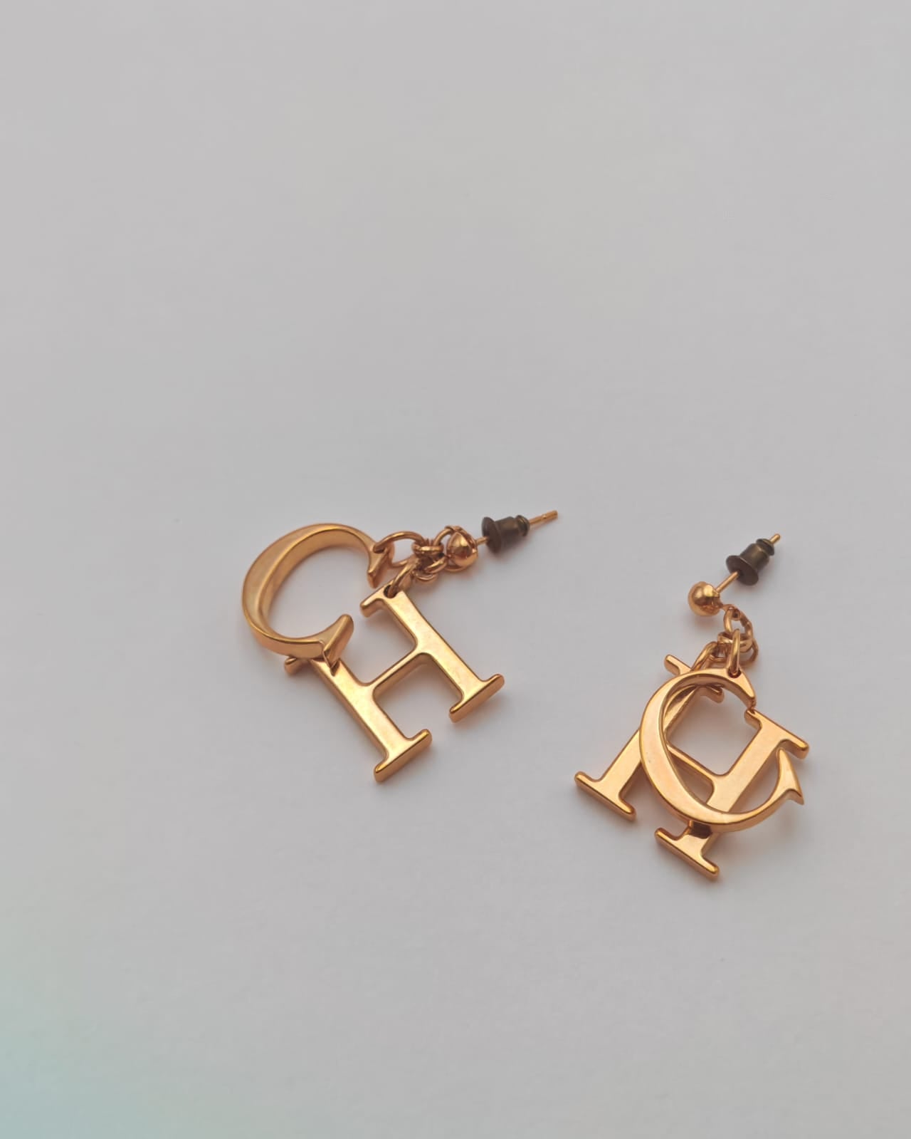 Carolina Herrera Gold-Tone “CH” Logo Drop Earrings – Statement Design