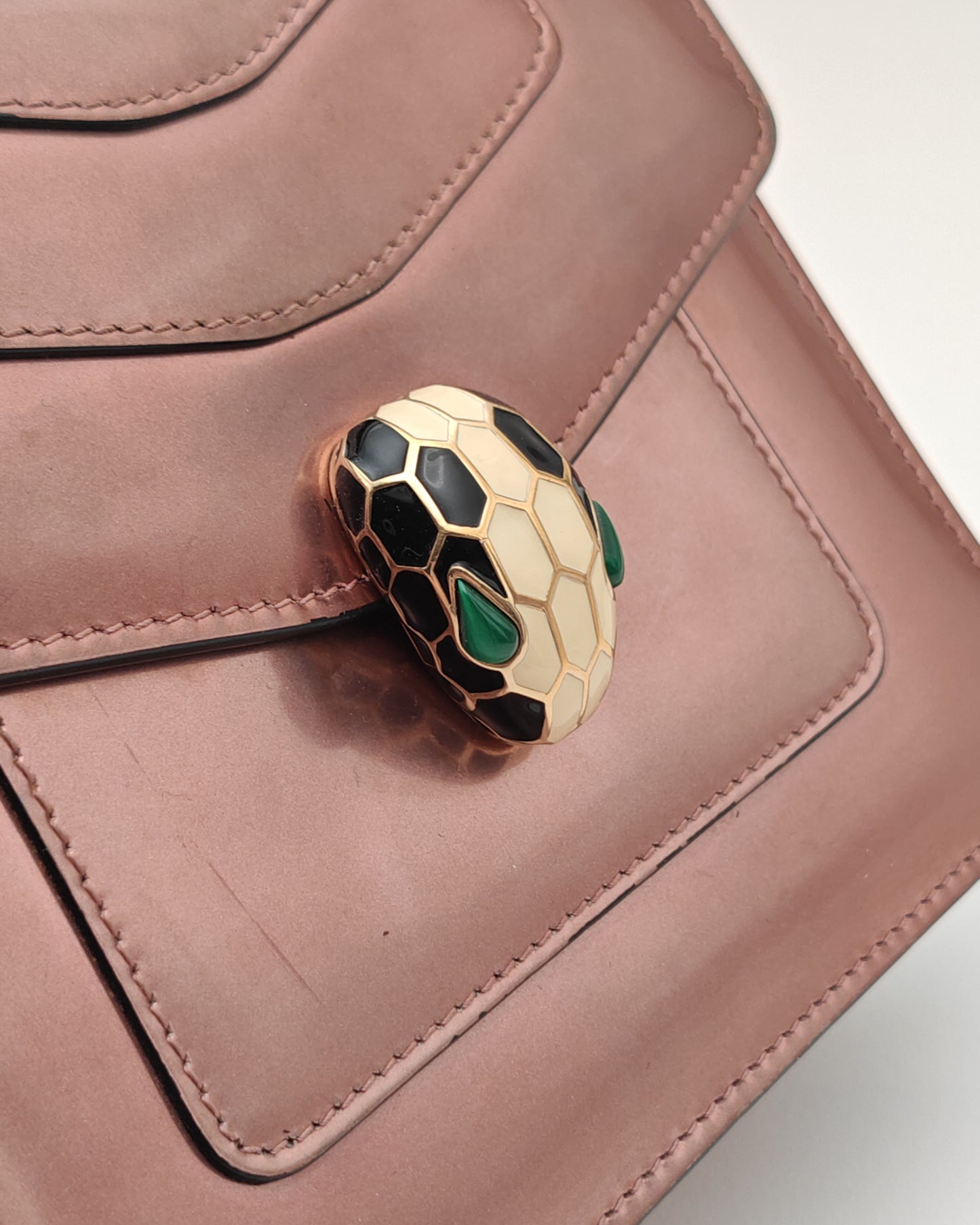Bvlgari Serpenti Forever Top Handle Bag in Metallic Rose Leather with Gold Hardware.