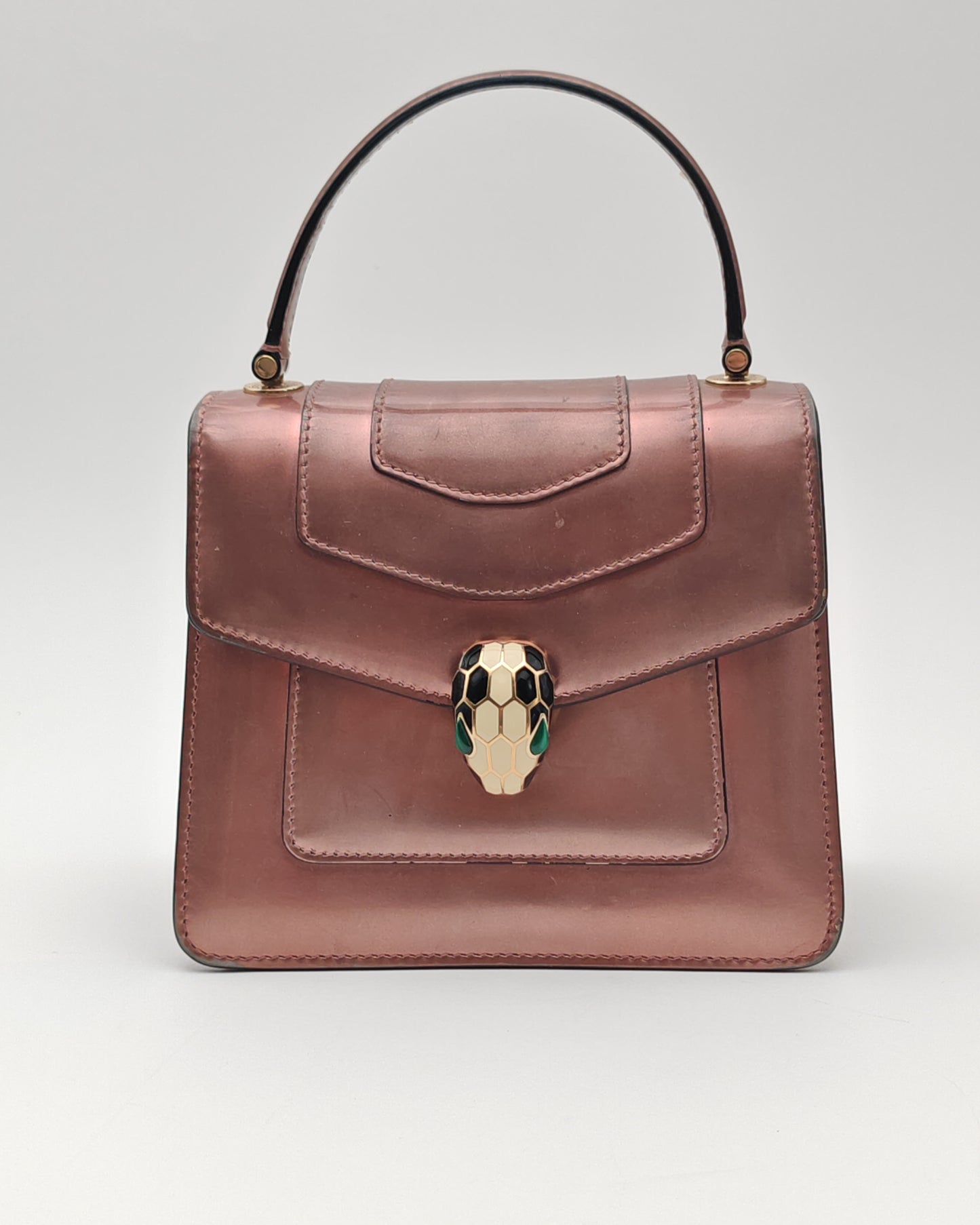 Bvlgari Serpenti Forever Top Handle Bag in Metallic Rose Leather with Gold Hardware.