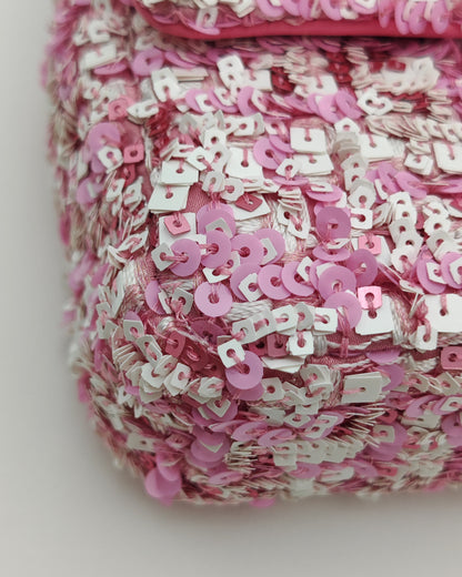 Chanel Mini Flap Bag in Pink Sequin Tweed with Gold Hardware.