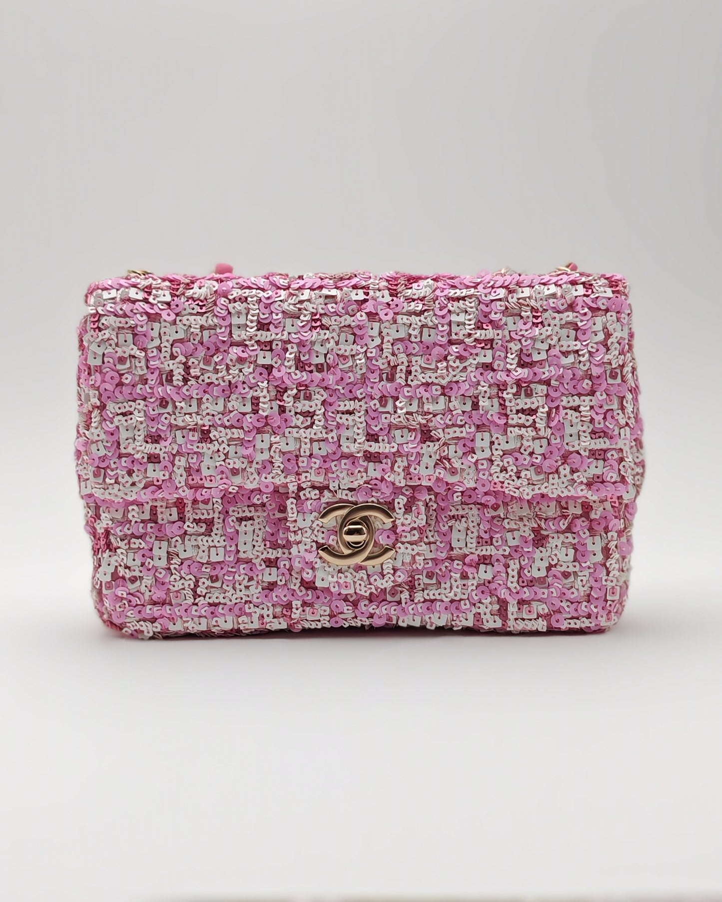 Chanel Mini Flap Bag in Pink Sequin Tweed with Gold Hardware.