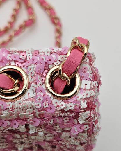 Chanel Mini Flap Bag in Pink Sequin Tweed with Gold Hardware.