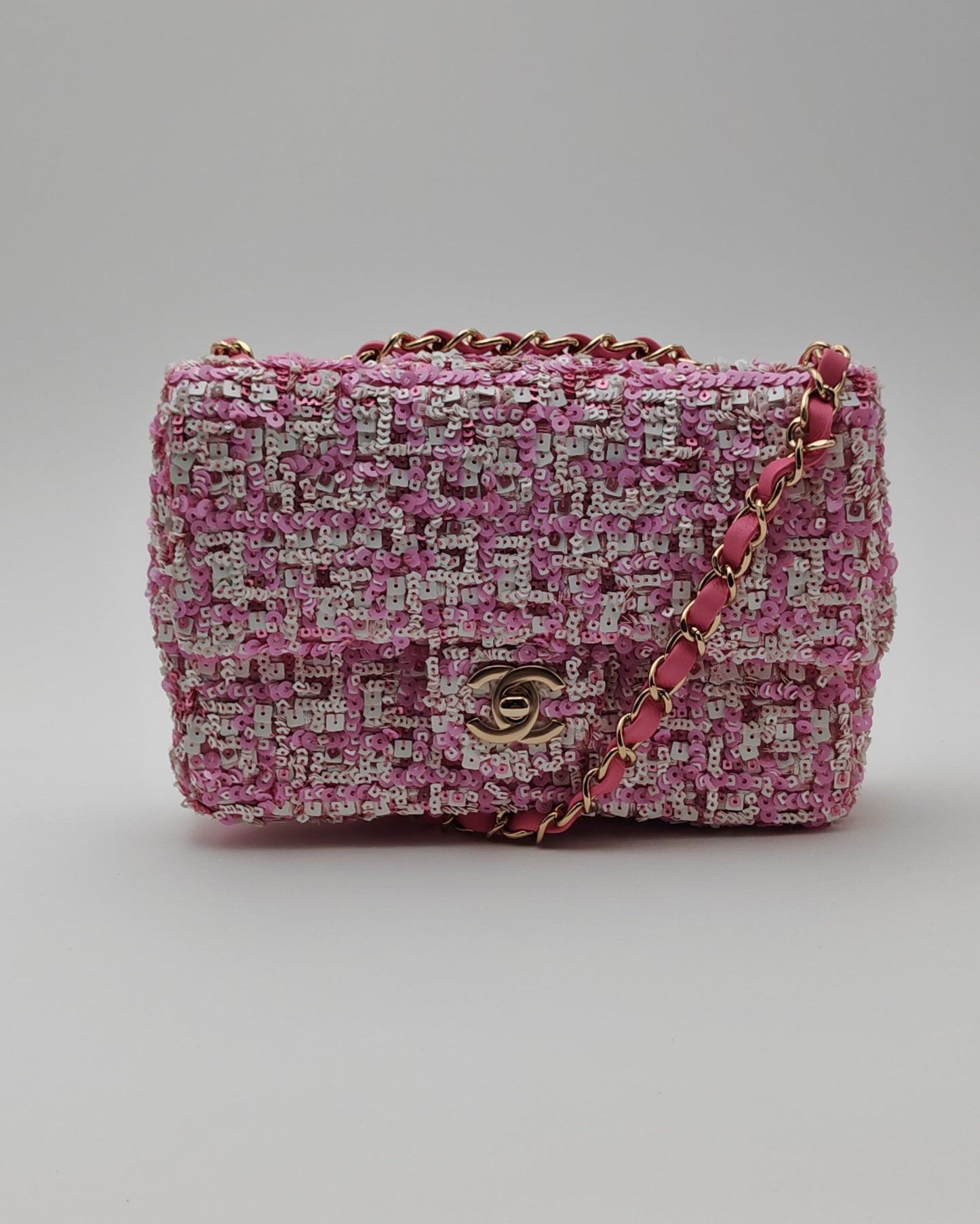 Chanel Mini Flap Bag in Pink Sequin Tweed with Gold Hardware.