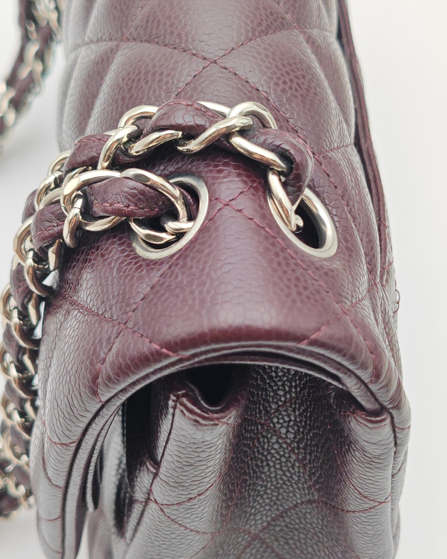 Chanel Classic Jumbo Double Flap Bag in Dark Burgundy Caviar Leather with Silver Hardware.