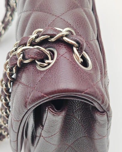 Chanel Classic Jumbo Double Flap Bag in Dark Burgundy Caviar Leather with Silver Hardware.