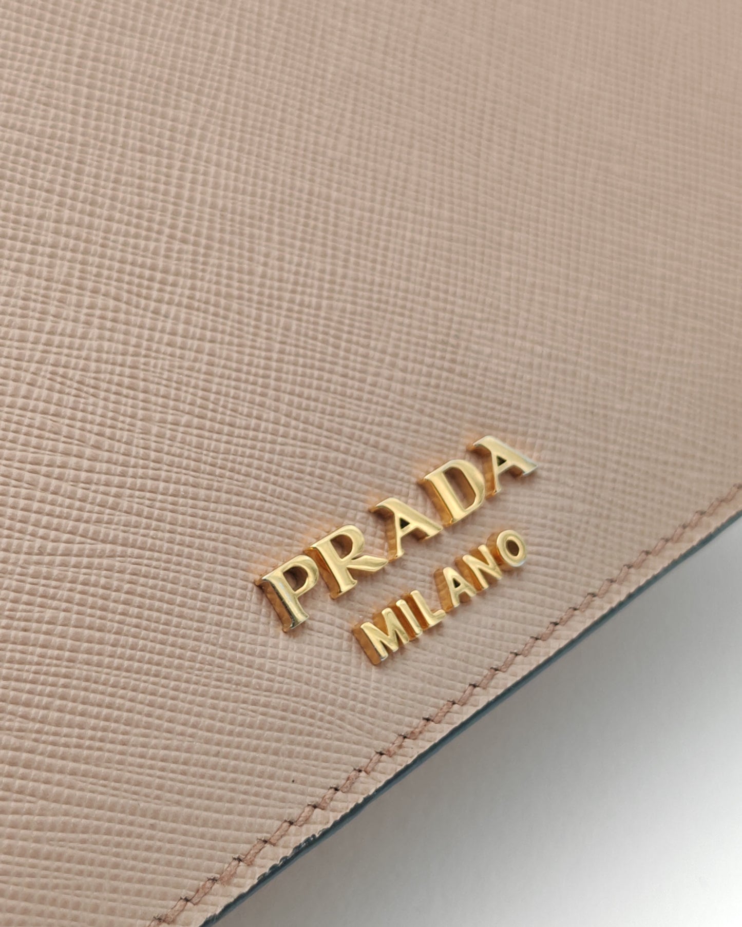 Prada Diagramme Envelope Shoulder Bag in Nude Saffiano Leather with Gold Hardware.