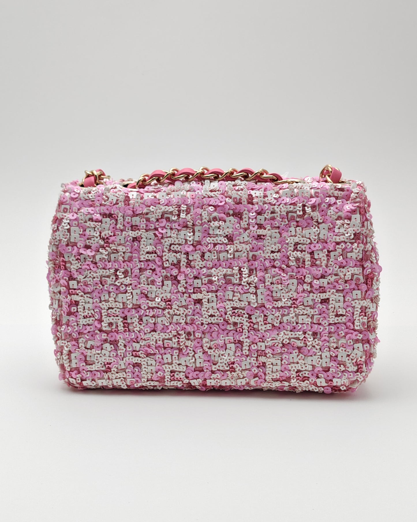 Chanel Mini Flap Bag in Pink Sequin Tweed with Gold Hardware.