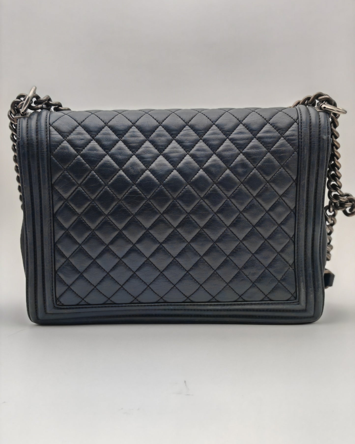 Chanel Boy Bag Large in Navy Quilted Calfskin with Ruthenium Hardware.