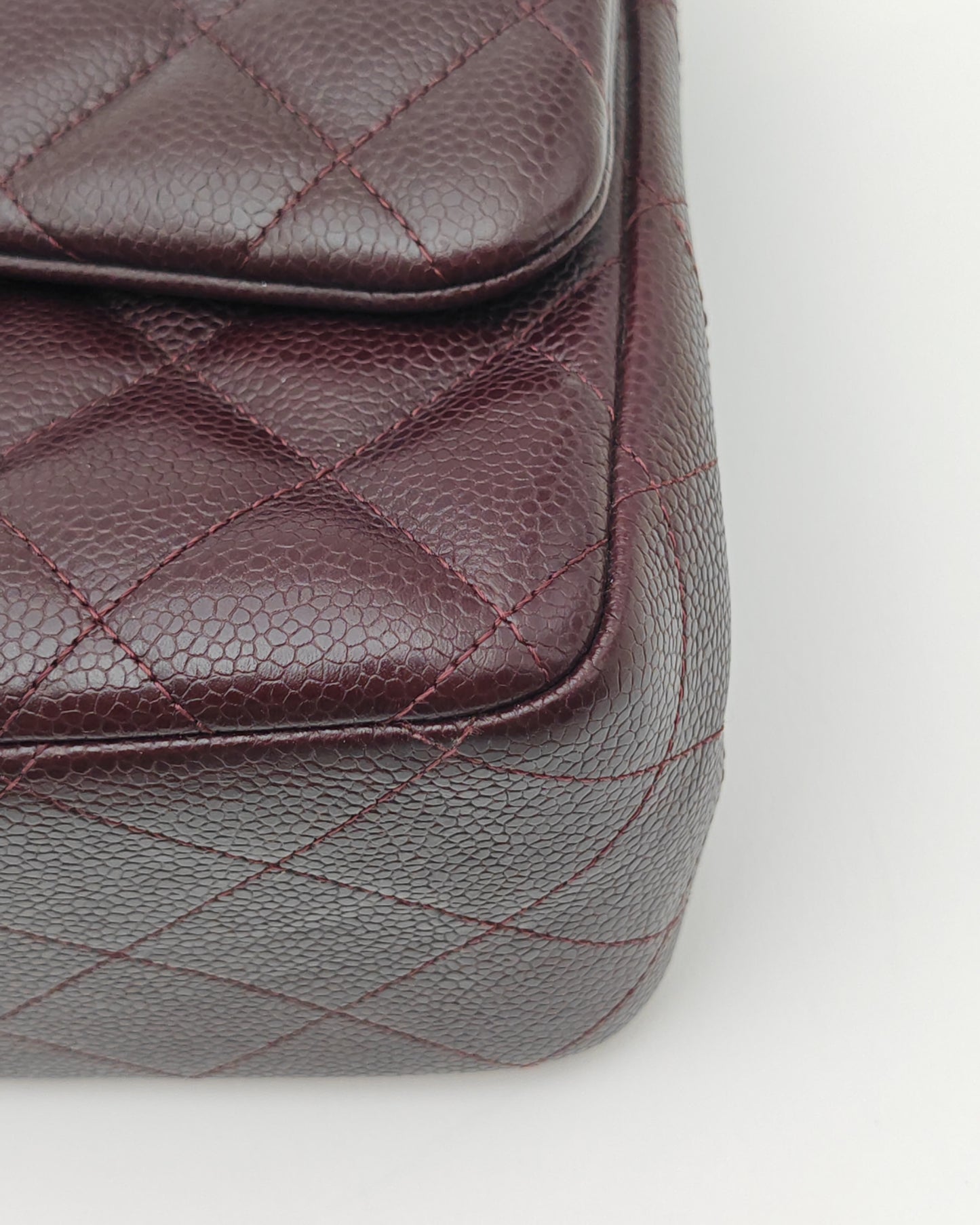 Chanel Classic Jumbo Double Flap Bag in Dark Burgundy Caviar Leather with Silver Hardware.