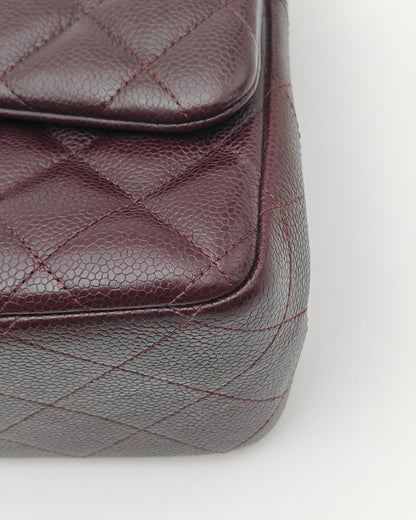 Chanel Classic Jumbo Double Flap Bag in Dark Burgundy Caviar Leather with Silver Hardware.