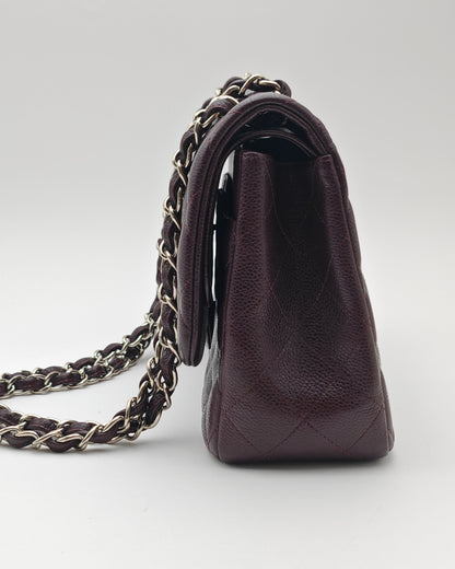 Chanel Classic Jumbo Double Flap Bag in Dark Burgundy Caviar Leather with Silver Hardware.