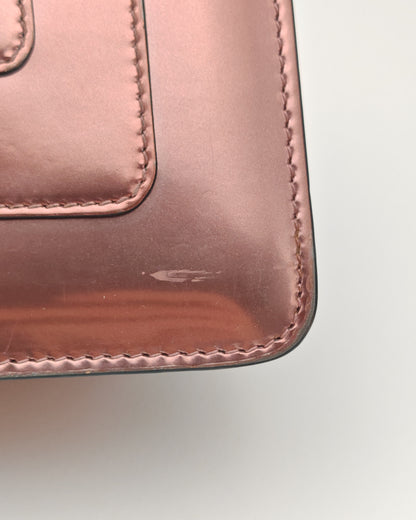 Bvlgari Serpenti Forever Top Handle Bag in Metallic Rose Leather with Gold Hardware.
