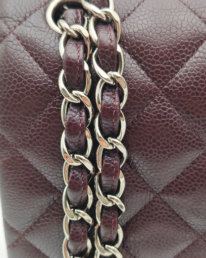 Chanel Classic Jumbo Double Flap Bag in Dark Burgundy Caviar Leather with Silver Hardware.
