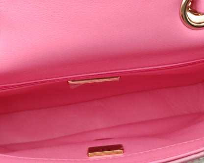 Chanel Mini Flap Bag in Pink Sequin Tweed with Gold Hardware.