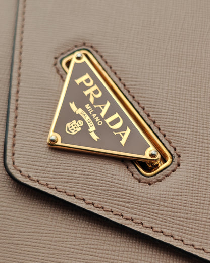 Prada Diagramme Envelope Shoulder Bag in Nude Saffiano Leather with Gold Hardware.
