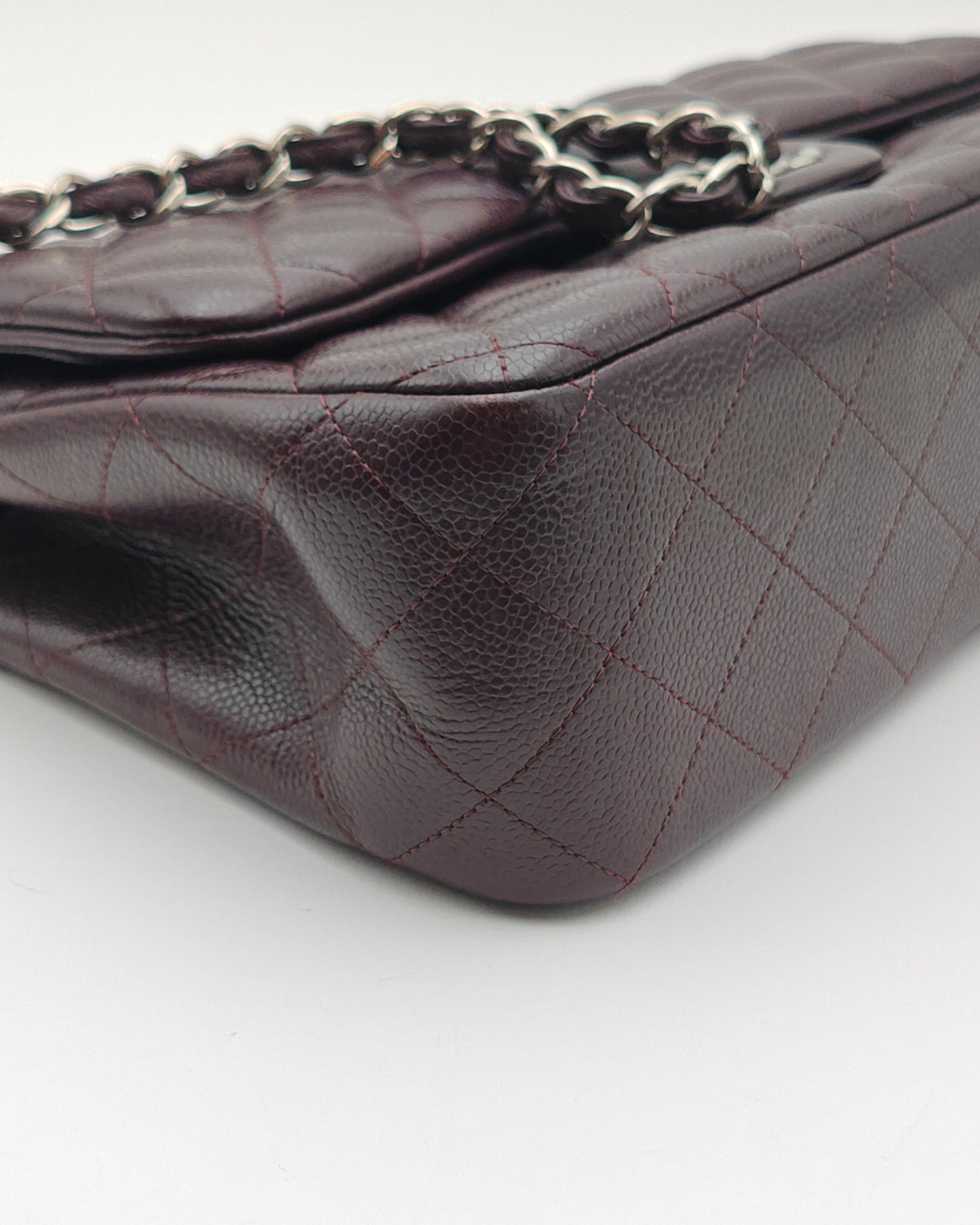Chanel Classic Jumbo Double Flap Bag in Dark Burgundy Caviar Leather with Silver Hardware.
