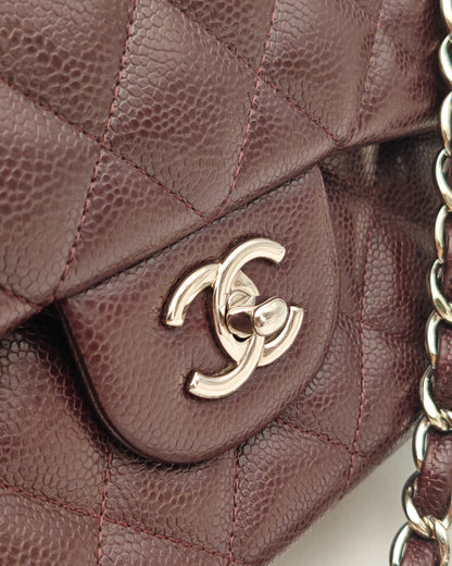Chanel Classic Jumbo Double Flap Bag in Dark Burgundy Caviar Leather with Silver Hardware.