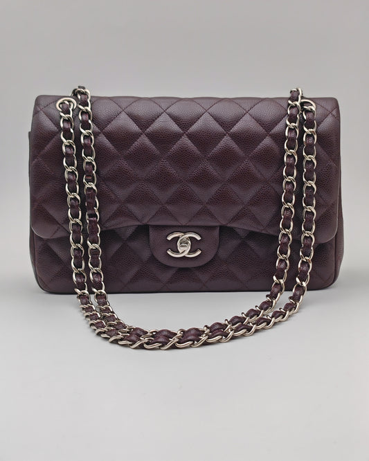 Chanel Classic Jumbo Double Flap Bag in Dark Burgundy Caviar Leather with Silver Hardware.