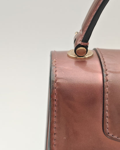 Bvlgari Serpenti Forever Top Handle Bag in Metallic Rose Leather with Gold Hardware.
