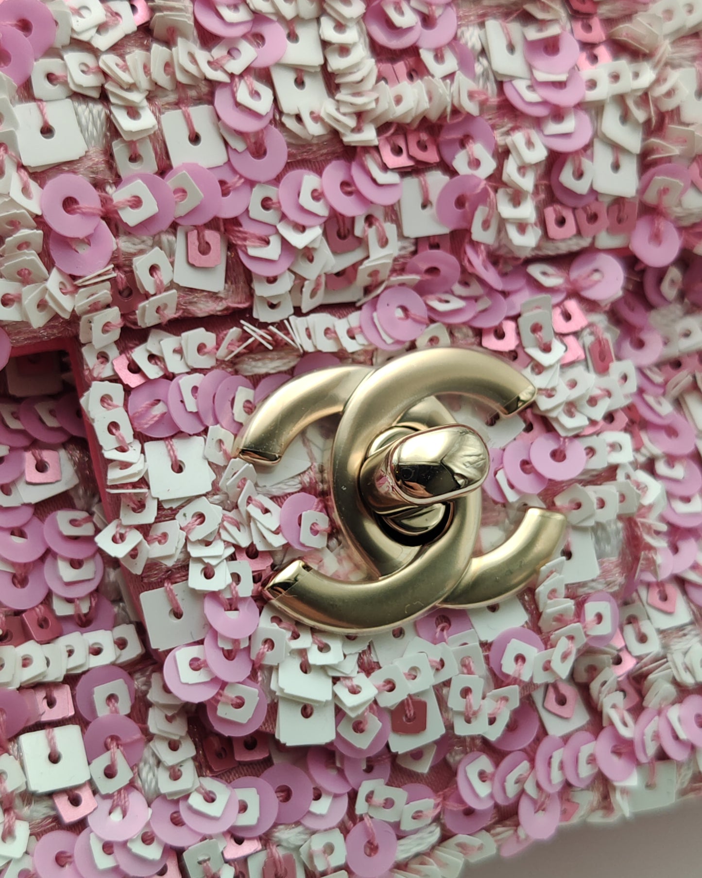 Chanel Mini Flap Bag in Pink Sequin Tweed with Gold Hardware.