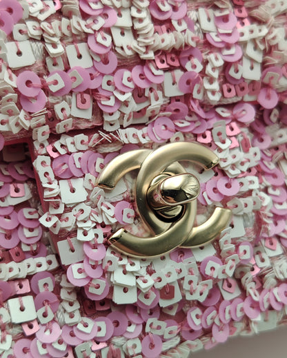 Chanel Mini Flap Bag in Pink Sequin Tweed with Gold Hardware.