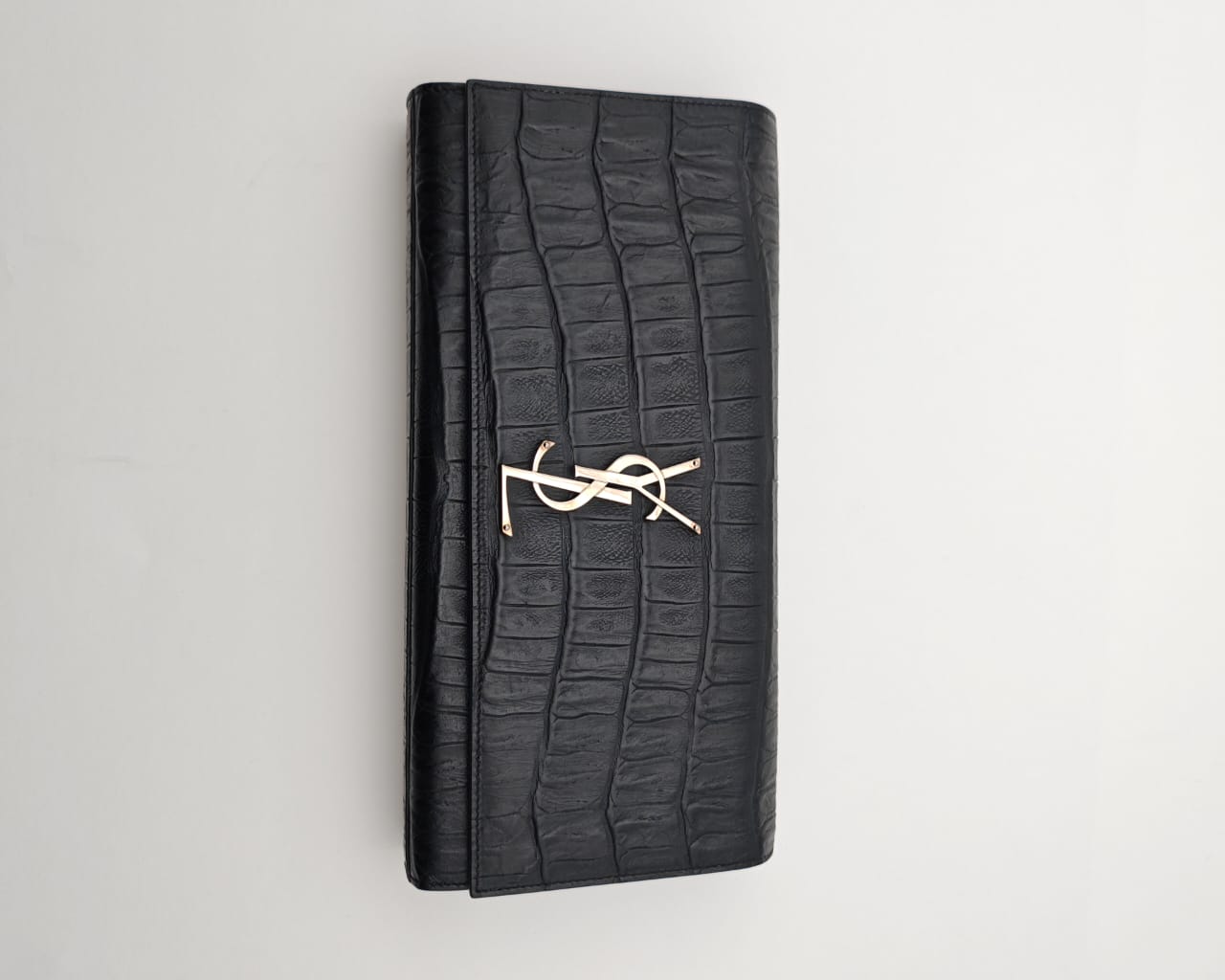 Saint Laurent Classic Monogram Clutch in crocodile-embossed leather