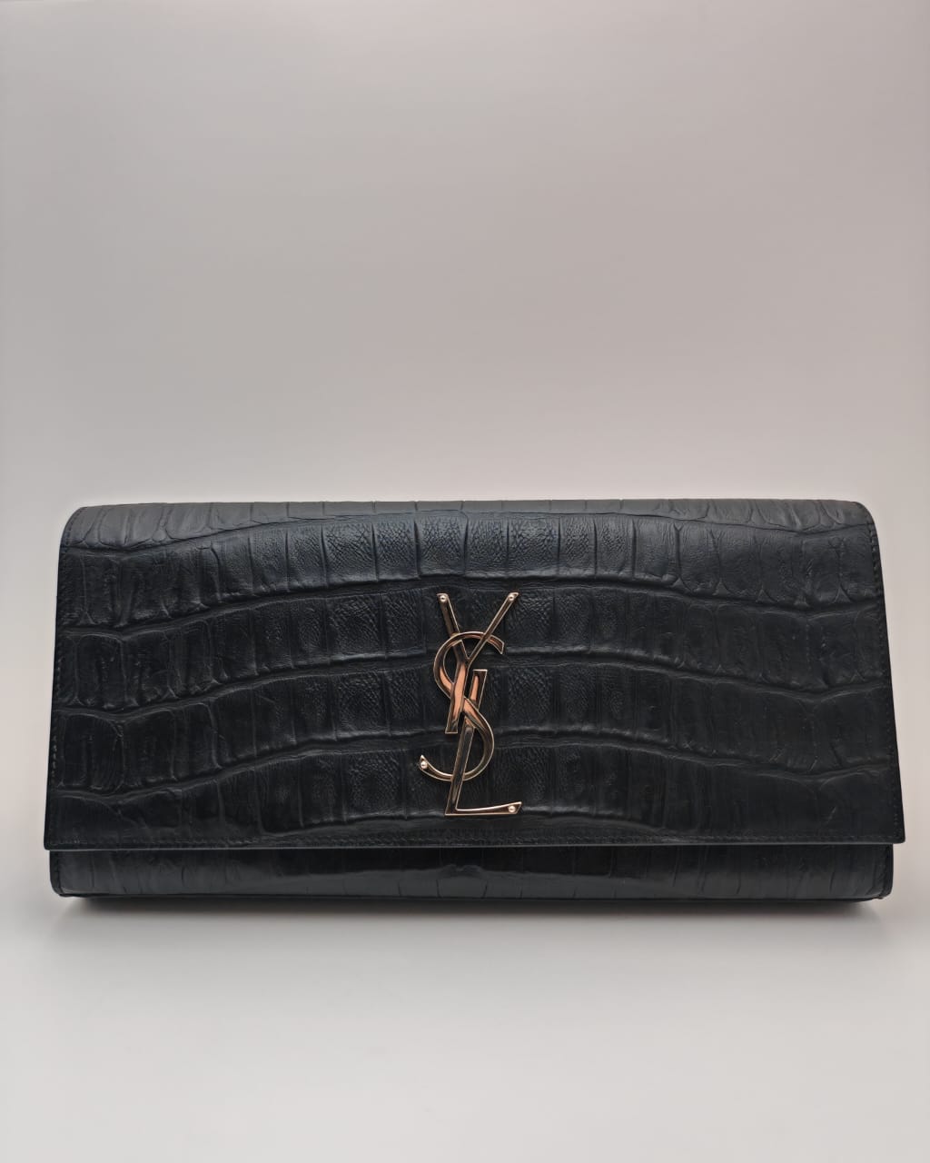 Saint Laurent Classic Monogram Clutch in crocodile-embossed leather