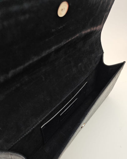 Saint Laurent Classic Monogram Clutch in crocodile-embossed leather