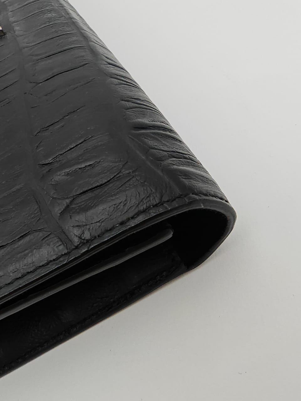 Saint Laurent Classic Monogram Clutch in crocodile-embossed leather