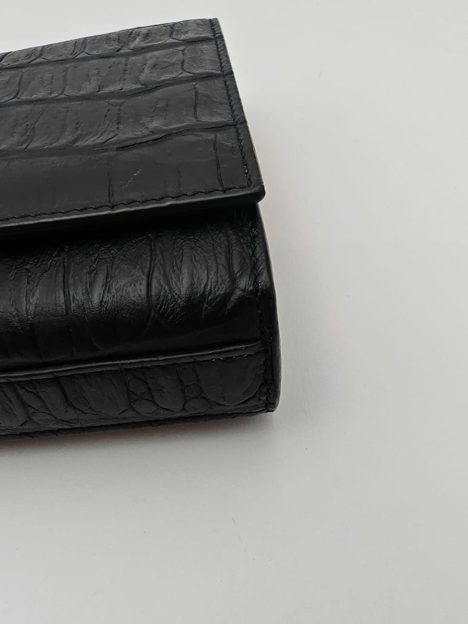 Saint Laurent Classic Monogram Clutch in crocodile-embossed leather