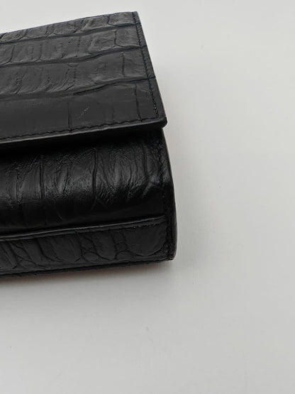 Saint Laurent Classic Monogram Clutch in crocodile-embossed leather
