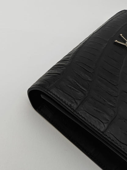 Saint Laurent Classic Monogram Clutch in crocodile-embossed leather